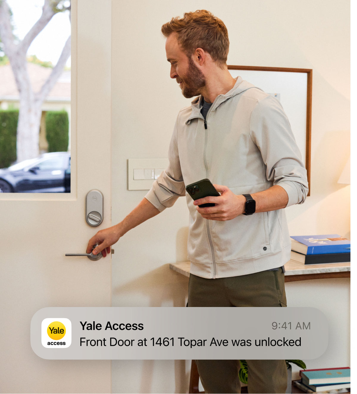 man closing door