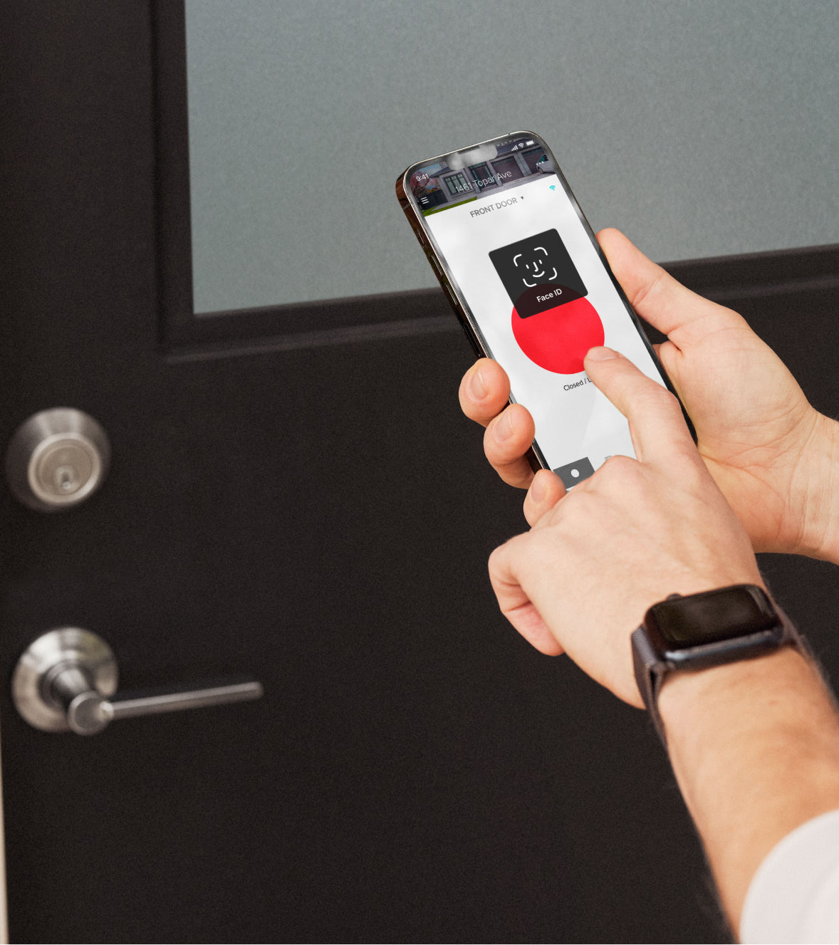 hands holding phone with screen with facial recognition