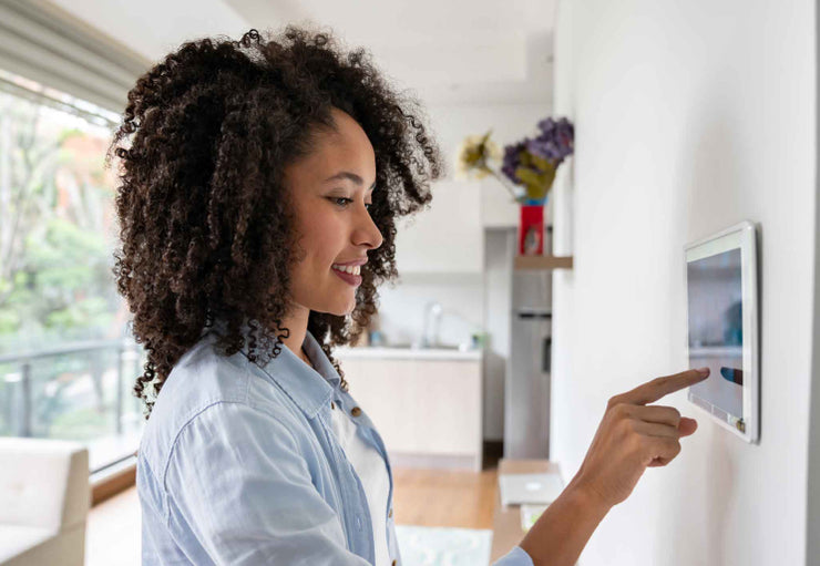 woman setting alarm system