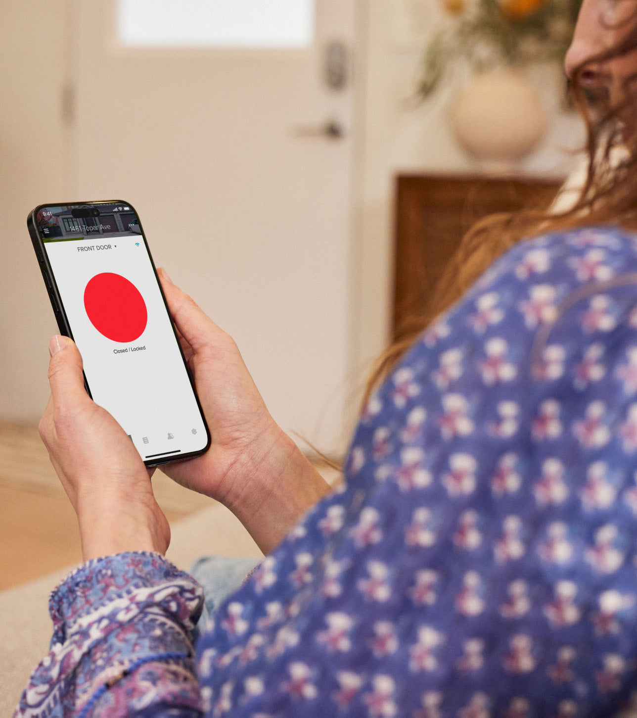 woman with phone showing locked state
